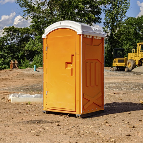 what is the cost difference between standard and deluxe portable restroom rentals in Mendon